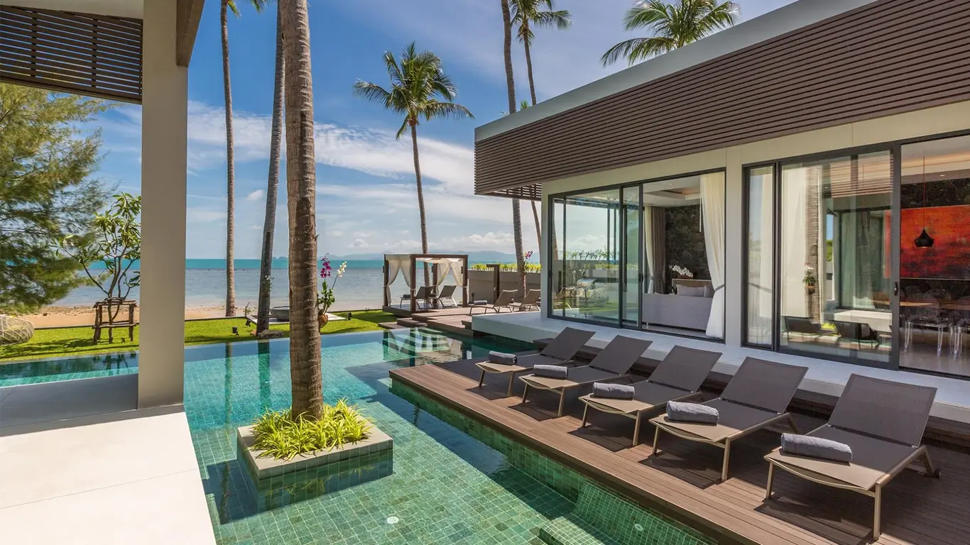 Glass-Walled Beachfront Villa with Infinity Pool